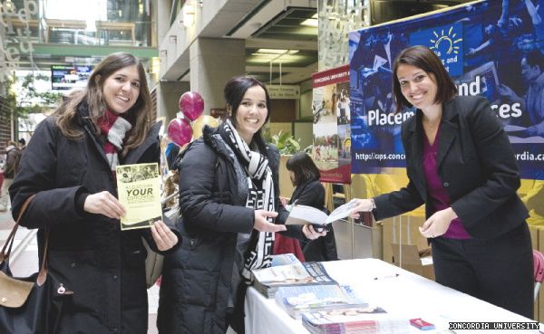 Career and Placement Services career advisor Chanel Bourdon hands out leaflets to political science students Ulker Gurun (far left) and Saliha Hashuri at the Rediscover Concordia Student Services Fair in the atrium of the Library Building on Jan. 20.